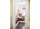 Quaint bathroom featuring wood paneling, a pedestal sink, and a window, creating a charming vintage feel at 677 N Gilpin St, Denver, CO 80218