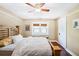 Warm bedroom with a wooden bed frame, a window with blinds, and hardwood floors, creating a cozy retreat at 677 N Gilpin St, Denver, CO 80218