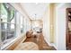 Bright dining area with large windows, hardwood floors, stylish lighting, and comfortable seating at 677 N Gilpin St, Denver, CO 80218