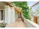 Charming entrance featuring a brick walkway, lush greenery, and a classic exterior lighting fixture at 677 N Gilpin St, Denver, CO 80218