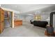 Finished basement area featuring a log bar and a free standing fireplace at 9868 Overlook Rd, Sedalia, CO 80135