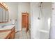 Traditional bathroom featuring a shower and a decorative wood vanity at 9868 Overlook Rd, Sedalia, CO 80135