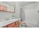 Bright bathroom featuring a toilet and tub/shower combination at 9868 Overlook Rd, Sedalia, CO 80135