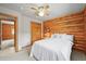 Comfortable bedroom features a bright window with wood accents creating a relaxing space at 9868 Overlook Rd, Sedalia, CO 80135