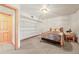 Basement bedroom featuring a comfortable bed, wood trim, carpeted floors, built-in storage, and an inviting atmosphere at 9868 Overlook Rd, Sedalia, CO 80135