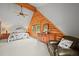 Spacious bedroom featuring log walls, large windows, and comfortable seating at 9868 Overlook Rd, Sedalia, CO 80135