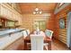 Dining room with views through to the kitchen, breakfast bar, and natural light at 9868 Overlook Rd, Sedalia, CO 80135