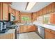 Well-equipped kitchen featuring stainless steel appliances, granite countertops, and custom cabinets at 9868 Overlook Rd, Sedalia, CO 80135