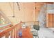 Upper level loft space featuring wood ceilings, stone wall, and natural light creating a cozy and inviting atmosphere at 9868 Overlook Rd, Sedalia, CO 80135