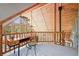 Cozy loft space with wood accents, desk, chair, and natural light, ideal for a home office or reading nook at 9868 Overlook Rd, Sedalia, CO 80135
