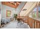 Charming office loft featuring wood ceilings, and natural light, ideal for work or relaxation at 9868 Overlook Rd, Sedalia, CO 80135