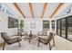 Inviting living area showcases exposed beams, skylights, wood floors, and a decorative rug at 456 Cherry St, Denver, CO 80220