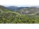 Overhead view of a tree-lined neighborhood nestled in the mountains, presenting a tranquil and scenic place to call home at 1020 10Th St, Boulder, CO 80302