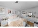 Charming bedroom with white paneled walls, warm decor, and hardwood floors at 1020 10Th St, Boulder, CO 80302