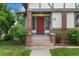 Inviting front entrance with a red door and stone steps at 1020 10Th St, Boulder, CO 80302