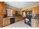 Functional kitchen features modern appliances, wood cabinetry, and tiled flooring at 1020 10Th St, Boulder, CO 80302