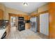 Functional kitchen with stainless steel appliances, tile flooring, and wood cabinetry at 1020 10Th St, Boulder, CO 80302
