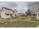 Spacious backyard with a well-maintained lawn, a patio area, and a wooden fence at 20910 Omaha Ave, Parker, CO 80138