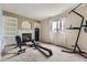 Versatile bonus room with a fireplace, providing space for exercise equipment and additional storage options at 20910 Omaha Ave, Parker, CO 80138