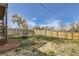 Spacious fenced backyard features a fire pit with chairs, and ample room to entertain at 3225 Olive St, Denver, CO 80207