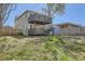 Fenced backyard with two-story deck, storage shed, and potential for outdoor activities at 3225 Olive St, Denver, CO 80207