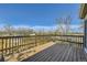 Wooden deck with railings offers a clear view, adding outdoor living space to enjoy at 3225 Olive St, Denver, CO 80207