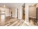 Spacious living room featuring hardwood floors, neutral walls and an open floor plan at 3225 Olive St, Denver, CO 80207