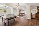 Finished basement features a ping pong table, bar and hardwood floors at 1653 Gore Dr, Larkspur, CO 80118