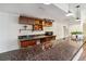 Finished basement bar with granite counters, microwave and cabinets at 1653 Gore Dr, Larkspur, CO 80118
