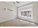Bedroom showcases a window seat, neutral carpeting, and natural light that fills the space at 1653 Gore Dr, Larkspur, CO 80118