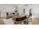 Bright living room with a vaulted ceiling, hardwood floors, and a neutral color palette at 1653 Gore Dr, Larkspur, CO 80118