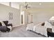 Bright main bedroom with a ceiling fan, seating area, and comfortable furnishings at 1653 Gore Dr, Larkspur, CO 80118