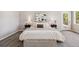 Light and airy main bedroom with neutral colors, a view of the pines, and comfortable furnishings at 1653 Gore Dr, Larkspur, CO 80118