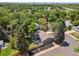 Overhead view of home featuring a large backyard, patio, and lush surroundings at 7092 E Mexico Ave, Denver, CO 80224
