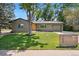 Well-manicured lawn and mature tree accent the facade of this charming single-Gathering home at 7092 E Mexico Ave, Denver, CO 80224