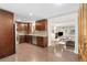 Open layout showcasing the kitchen's sleek cabinets, stainless appliances and seamless flow into living area at 7092 E Mexico Ave, Denver, CO 80224