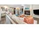 Spacious living room showcases an open layout, fireplace, and access to the backyard patio at 7092 E Mexico Ave, Denver, CO 80224