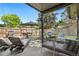 Inviting patio with lounge seating, dining set, grill, and string lights, perfect for outdoor relaxation and entertaining at 7092 E Mexico Ave, Denver, CO 80224