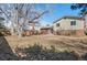 Large backyard area with mature trees at 6823 Coors St, Arvada, CO 80004