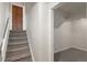 View of the basement entrance, carpeted stairs, and access to additional rooms at 6823 Coors St, Arvada, CO 80004