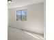 Bedroom with neutral walls and carpet and natural light from one large window at 6823 Coors St, Arvada, CO 80004