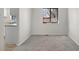 Bright bedroom with neutral walls and new carpet, and window allowing natural light to illuminate the space at 6823 Coors St, Arvada, CO 80004