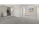 Bright living room featuring neutral carpet, a staircase, and ample natural light at 6823 Coors St, Arvada, CO 80004