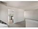 Bright living room view into kitchen with stainless appliances and modern finishes at 6823 Coors St, Arvada, CO 80004