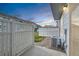 Cozy back patio with a white picket fence and a view of the surrounding neighborhood at 19046 E 57Th Pl # B, Denver, CO 80249