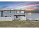 A well-maintained backyard with a grassy area and a white picket fence for added privacy at 19046 E 57Th Pl # B, Denver, CO 80249