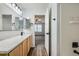 Bathroom featuring granite countertops, undermount sink and shower with tile surround at 19046 E 57Th Pl # B, Denver, CO 80249