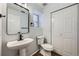 Modern bathroom with a white vessel sink, sleek black faucet, and updated fixtures at 19046 E 57Th Pl # B, Denver, CO 80249