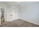 This bedroom features neutral carpet, a closet, and a spacious layout at 19046 E 57Th Pl # B, Denver, CO 80249