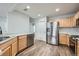 Well-equipped kitchen with stainless steel appliances, wooden cabinetry, and modern countertops at 19046 E 57Th Pl # B, Denver, CO 80249